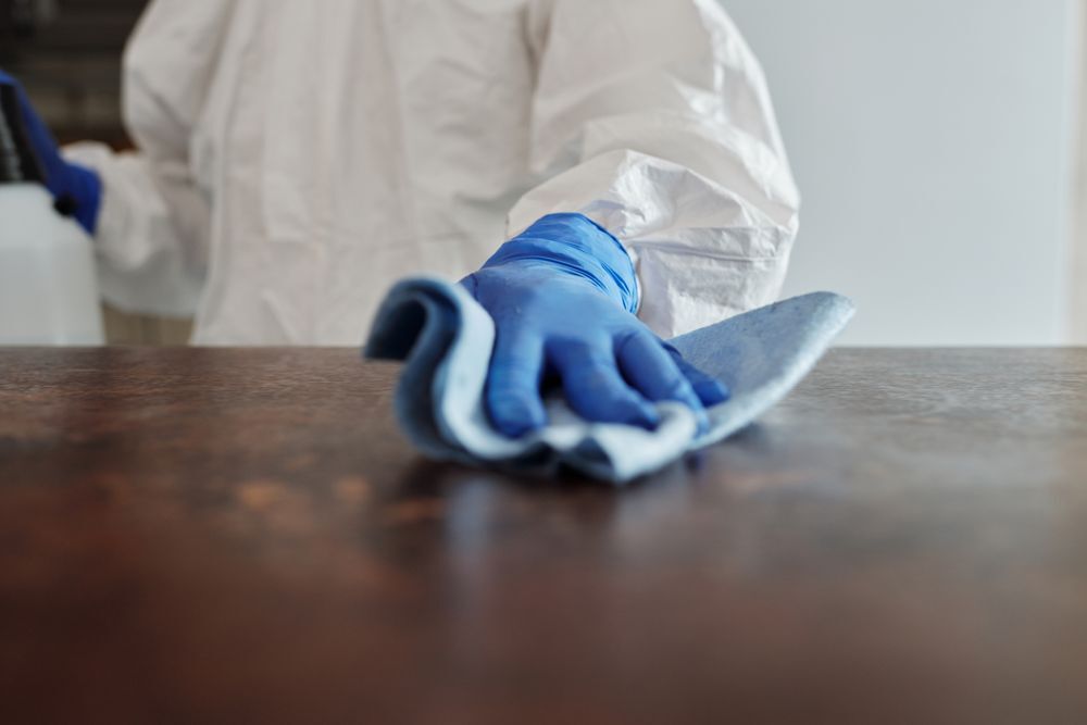 Cleaner wiping a table