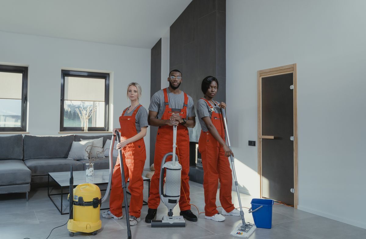 Professional cleaning team in a bright Austin living room