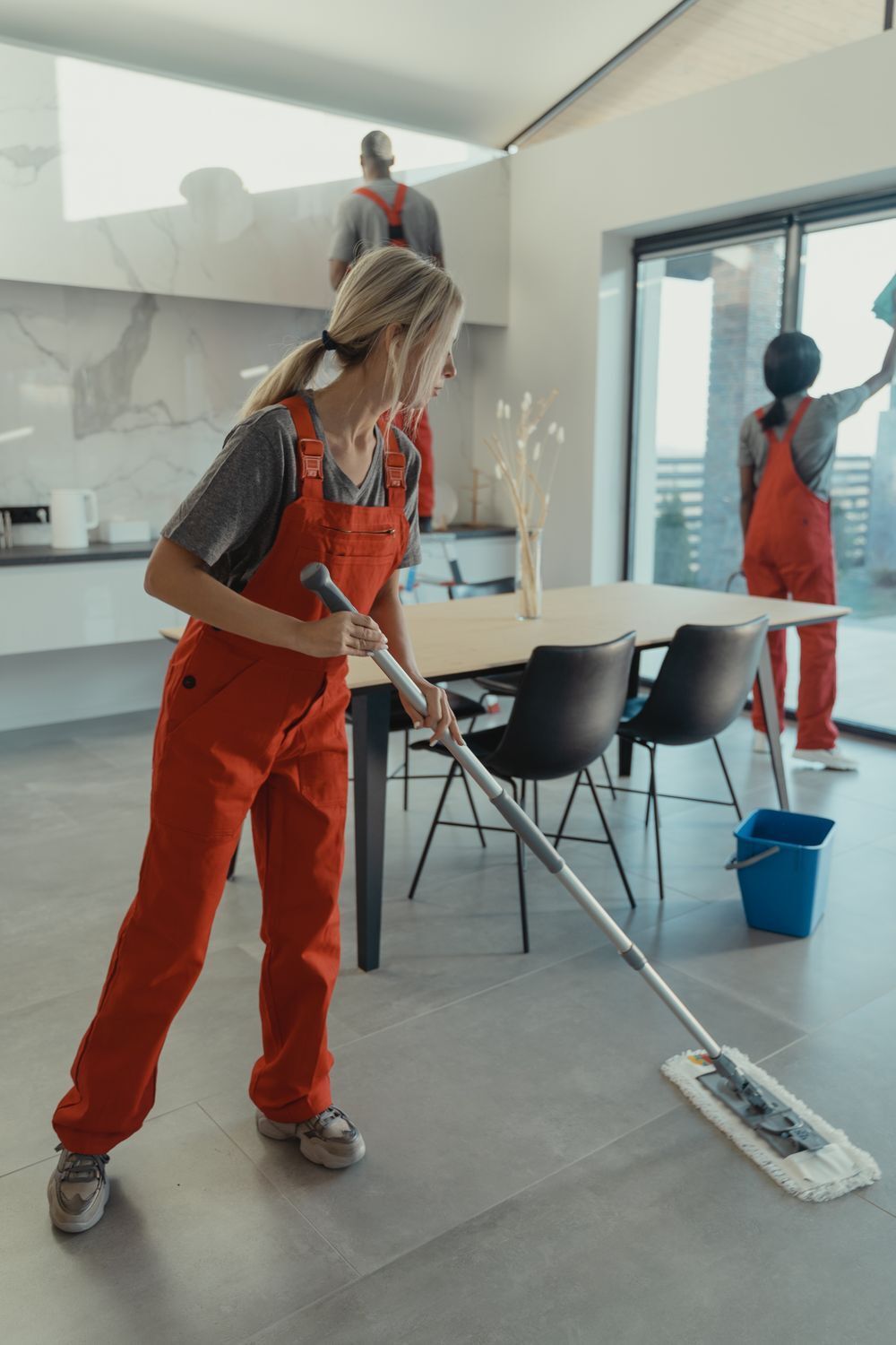 Cleaner mopping an open commercial space